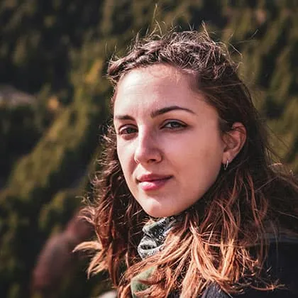 Alt Text:  Female digital marketing specialist smiling outdoors